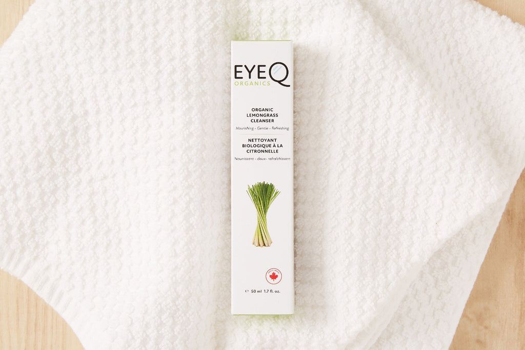 EYEQ organic cleanser in box indicating product is made in Canada on a white textured towel. Cleanser uses a capped pump applicator to dispense 2-3 drops of product, and cleanse face focusing on lash line and sensitive eye area. Rinse thoroughly. Avoid direct contact with eyes. Always remove contact lenses before use.